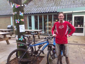 Happy man, dirty bike